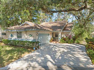 Attractive single-story home with a well-manicured lawn and a spacious driveway at 4727 Tivoli Ave, Sarasota, FL 34235