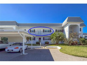 Exterior view of condo building with parking at 4736 Independence Dr # 4736, Bradenton, FL 34210