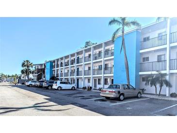 Building exterior showcasing a contemporary design and ample parking at 2228 Canal Dr # D26, Bradenton, FL 34207