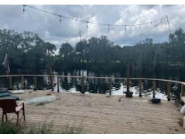 Large deck overlooking a tranquil waterway, perfect for relaxing and enjoying the view at 308 E Hollywood St, Tampa, FL 33604