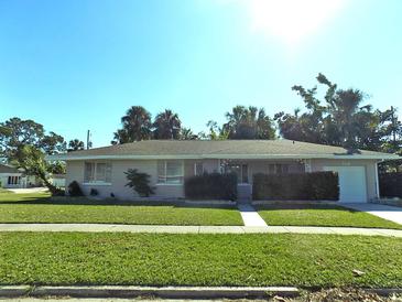 Ranch-style home with mature landscaping and a two-car garage at 2215 18Th W Ave, Bradenton, FL 34205