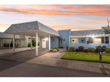 Cute light blue condo with carport and well-manicured landscaping at 3856 Trophy Blvd # 2, New Port Richey, FL 34655