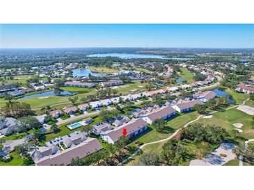 Aerial view of condo community near golf course and lake at 6713 Stone River Rd # 205, Bradenton, FL 34203