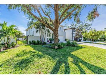 Attractive curb appeal with lush lawn and large tree at 2586 Prospect St, Sarasota, FL 34239