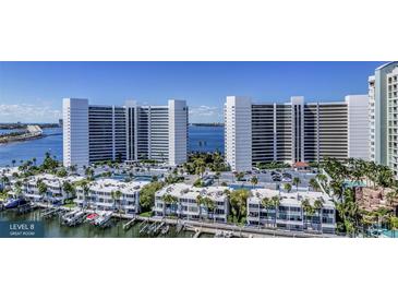Luxury waterfront community with multiple buildings, tennis courts, and marina at 555 Quay Cmn # 705, Sarasota, FL 34236
