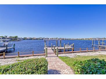 Private dock with walkway leading to a covered seating area overlooking the water at 1014 Overlook Ct, Bradenton, FL 34208