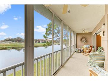 Spacious lanai overlooking a tranquil lake and golf course at 6620 Pineview Ter, Bradenton, FL 34203