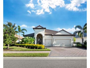 Beautiful single-story home with tile roof and two-car garage, landscaped front yard at 16528 Berwick Ter, Bradenton, FL 34202