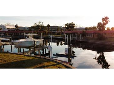 Aerial view of waterfront community with boat slips and canal at 4104 Catalina Dr, Bradenton, FL 34210