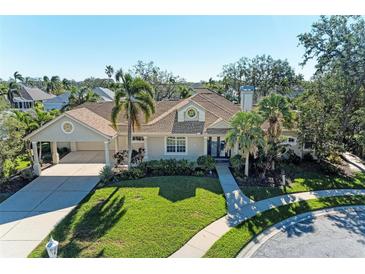 Single-Gathering home with a large yard, driveway, and walkway at 4712 Compass Dr, Bradenton, FL 34208