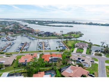 Breathtaking aerial view of waterfront property with private marina access and lush tropical landscaping at 312 Yacht Harbor Dr, Osprey, FL 34229