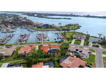 Stunning aerial view of waterfront homes with a private marina and beautiful water views at 312 Yacht Harbor Dr, Osprey, FL 34229