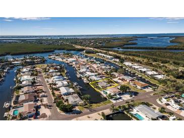 Aerial view of waterfront home with private dock and boat access at 10307 Sandpiper W Rd, Bradenton, FL 34209