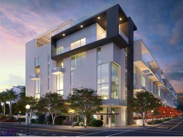 Modern condominium complex features sleek architecture, large windows, and a prime urban location at 1305 4Th St # 402P, Sarasota, FL 34236