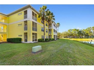 Building exterior showcasing yellow building and landscaping at 2060 Willow Hammock Cir # 304, Punta Gorda, FL 33983