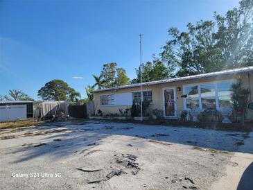 Ranch-style home with a spacious yard and single-car garage at 3008 Florida Blvd, Bradenton, FL 34207