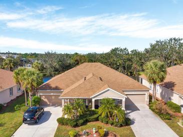 Single-Gathering home with two-car garage and lush landscaping at 4181 Lenox Blvd, Venice, FL 34293