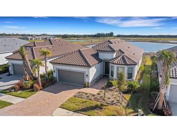 Single-Gathering home with tile roof and lake view at 10124 Silent Night Ln, Sarasota, FL 34241