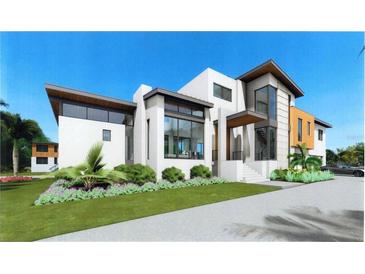 Modern two-story home with attached garage and landscaped yard at 5174 Sandy Cove Ave, Sarasota, FL 34242