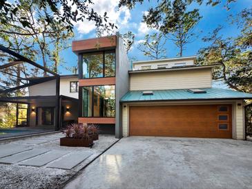 Modern two-story home with attached garage and pool at 2340 Arden Dr, Sarasota, FL 34232