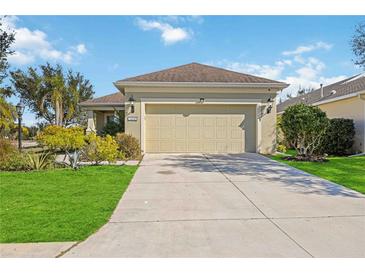 Single-story house with a two-car garage and landscaped front yard at 11634 Piedmont Park Xing, Bradenton, FL 34211