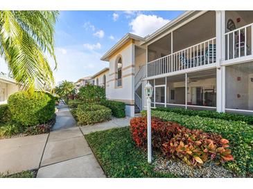 Neat walkway leading to condo building entrance at 6908 Drewrys Blf # 711, Bradenton, FL 34203