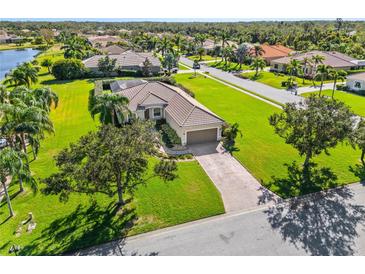 Single-Gathering home with large yard and attached garage; located in a quiet residential neighborhood at 14706 5Th Ne Ter, Bradenton, FL 34212