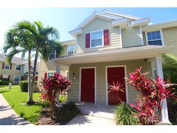 Two-story townhome with red doors and landscaping at 4850 51St W St # 8104, Bradenton, FL 34210