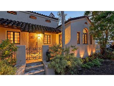 Spanish-style home with charming entryway and lush landscaping at 1858 Oak St, Sarasota, FL 34236