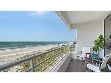 This home features a balcony with stunning views of the white sand beach and ocean at 2105 Gulf Of Mexico Dr # 3303, Longboat Key, FL 34228