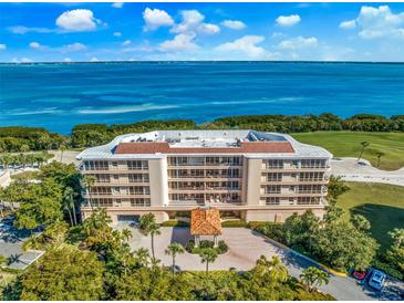 Luxury condo building with waterfront and golf course views at 3070 Grand Bay Blvd # 612, Longboat Key, FL 34228