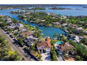 Bird's-eye view of waterfront home and community, highlighting the canal and surrounding area at 508 Siesta Dr, Sarasota, FL 34242