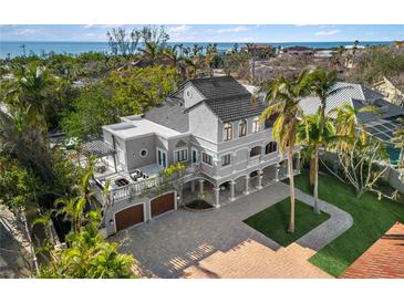 Luxury beachfront home with expansive driveway and ocean views at 8855 Midnight Pass Rd, Sarasota, FL 34242