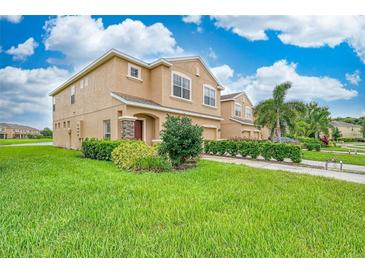 Two-story house with a landscaped lawn and stone accents at 11510 84Th Street E Cir # 101, Parrish, FL 34219