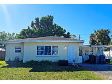Ranch-style home with a carport and a spacious yard at 3310 Lexington St, Sarasota, FL 34231