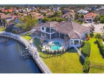 Luxury waterfront home with pool and dock, offering stunning canal views at 504 Mast Dr, Bradenton, FL 34208