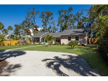 Newly renovated home with tropical landscaping and spacious yard at 1155 Tahiti Pkwy, Sarasota, FL 34236