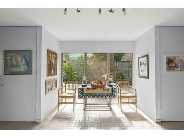 Bright breakfast nook features charming decor and natural light from the large window at 3350 Old Oak Dr, Sarasota, FL 34239