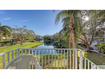 Relaxing balcony view overlooking a pond and lush landscaping at 850 S Tamiami Trl # 731, Sarasota, FL 34236