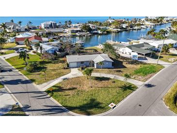 Charming single-story home with a well-maintained yard and waterfront views in a desirable neighborhood at 806 Arlington Rd, Palmetto, FL 34221