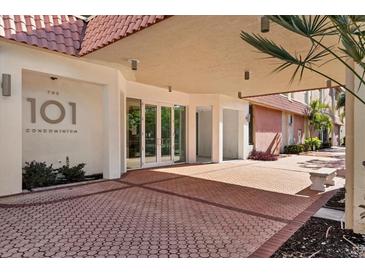 The 101 Condominium entrance features a covered walkway, double doors, and a brick-paved area at 101 S Gulfstream Ave # 15E, Sarasota, FL 34236