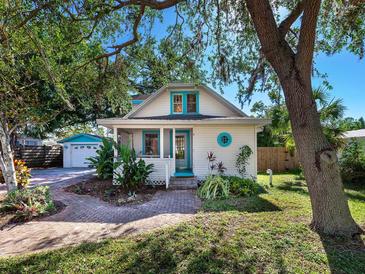 Charming bungalow with a white picket fence and landscaped yard at 2724 Ashton Rd, Sarasota, FL 34231