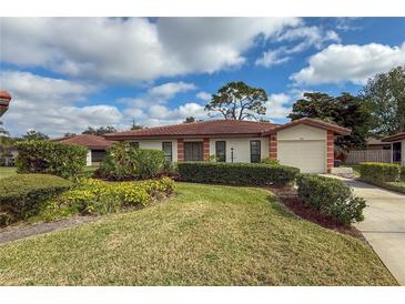 Single-story home with attached garage and well-manicured landscaping at 3001 Vivienda Blvd, Bradenton, FL 34207