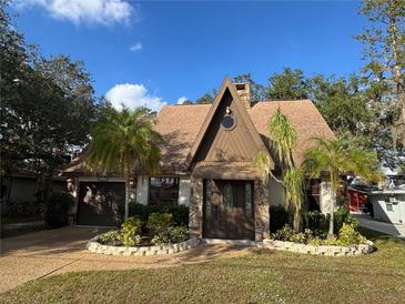 A-frame home with stone accents and landscaping at 3455 Gardenia St, Sarasota, FL 34237
