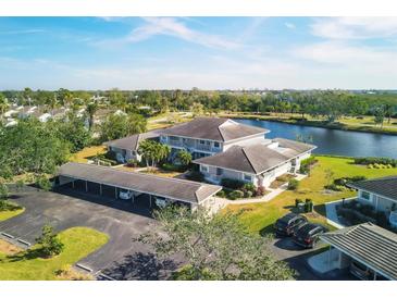 Community overview showcasing building and parking with waterfront views at 619 Estuary Dr, Bradenton, FL 34209