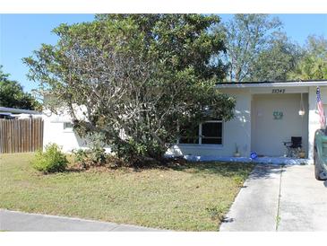 Cute ranch home with mature landscaping and a long driveway at 22342 Augusta Ave, Port Charlotte, FL 33952