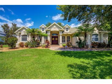 Beautiful two-story home with lush landscaping and a large front yard at 3706 162Nd E Ave, Parrish, FL 34219