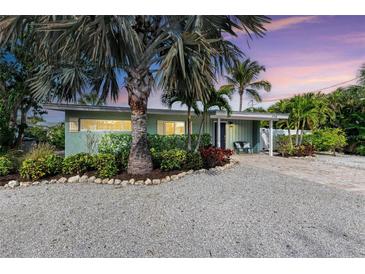 Charming mid-century home with landscaped yard and paver driveway at 312 Hardin Ave, Anna Maria, FL 34216