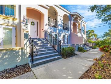 Front view of charming townhouses with walkway at 461 Nokomis S Ave, Venice, FL 34285