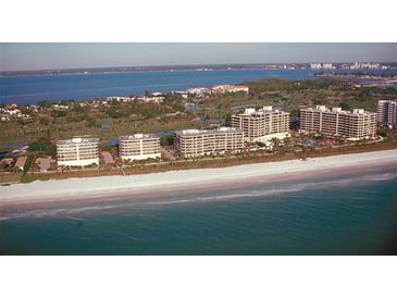 Aerial view of luxurious beachfront condo community at 575 Sanctuary Dr # A303, Longboat Key, FL 34228